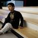 A Dicken Elementary School student sits on the steps of the stage after the Community of Cultures Assembly and Celebration on Friday, April 12. AnnArbor.com I Daniel Brenner